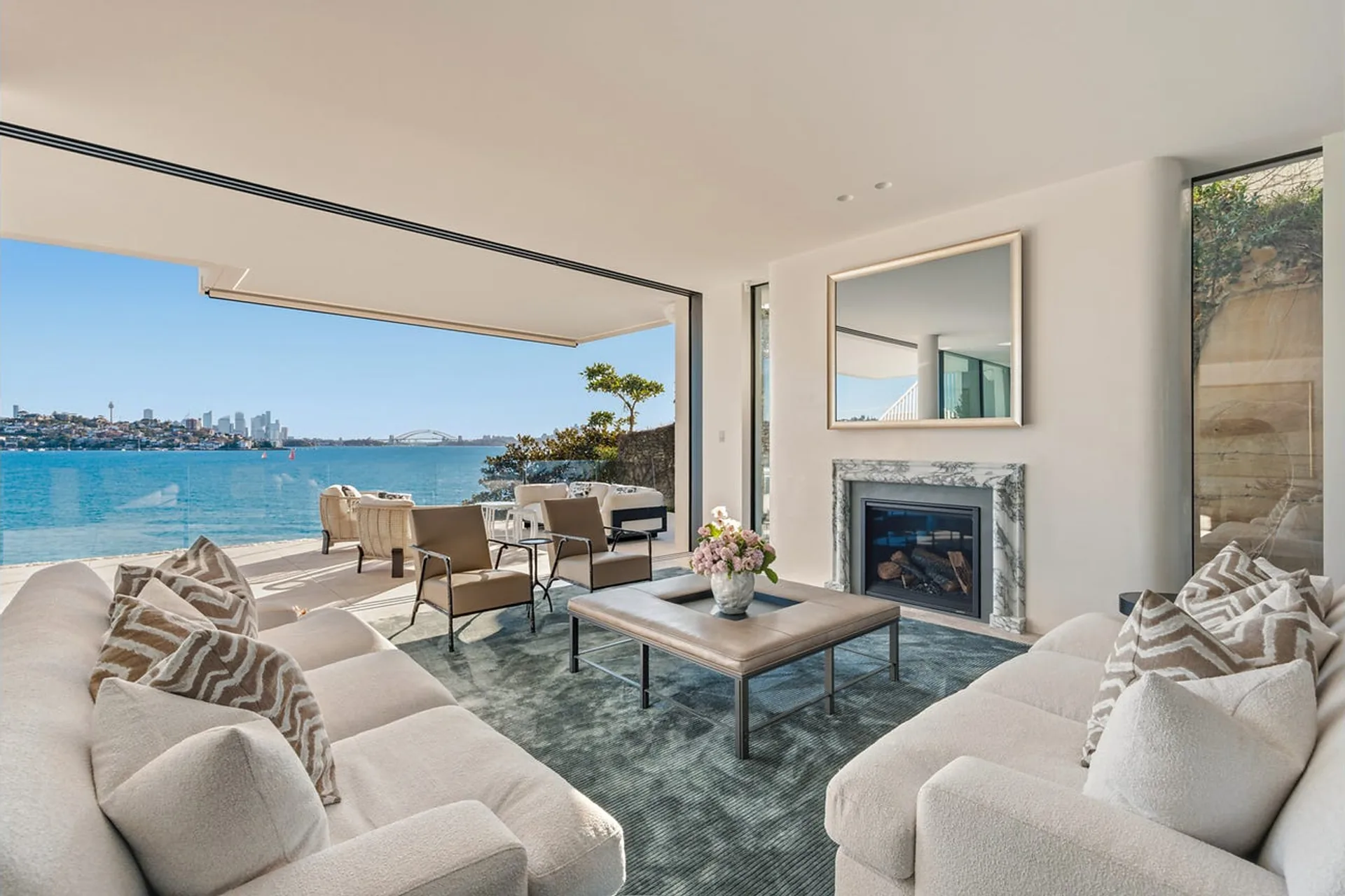 Bayview Hill Road, Rose Bay - living room and fireplace opening to the harbour terrace