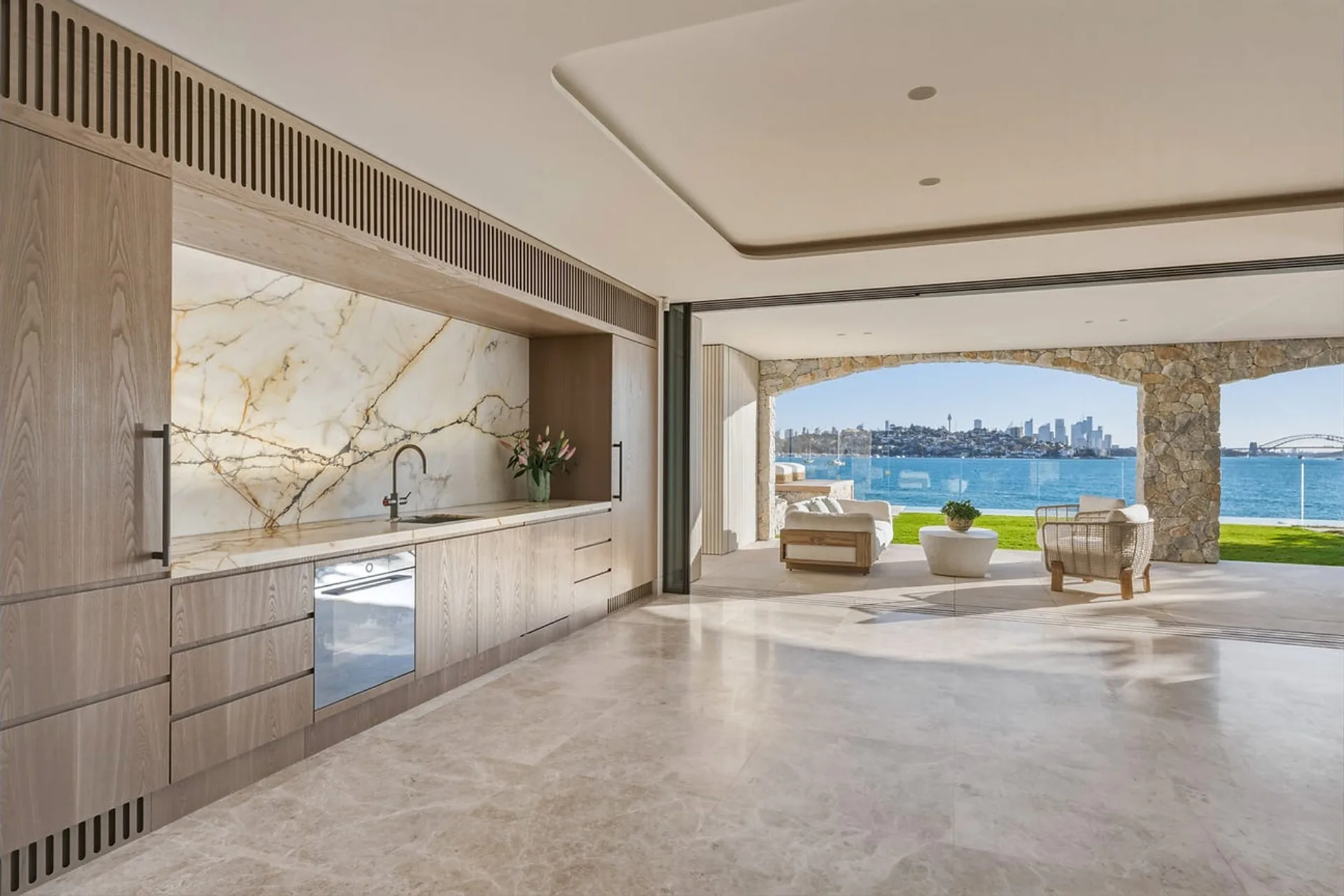 Bayview Hill Road, Rose Bay - kitchen joinery and marble splashback, terrace and harbour beyond