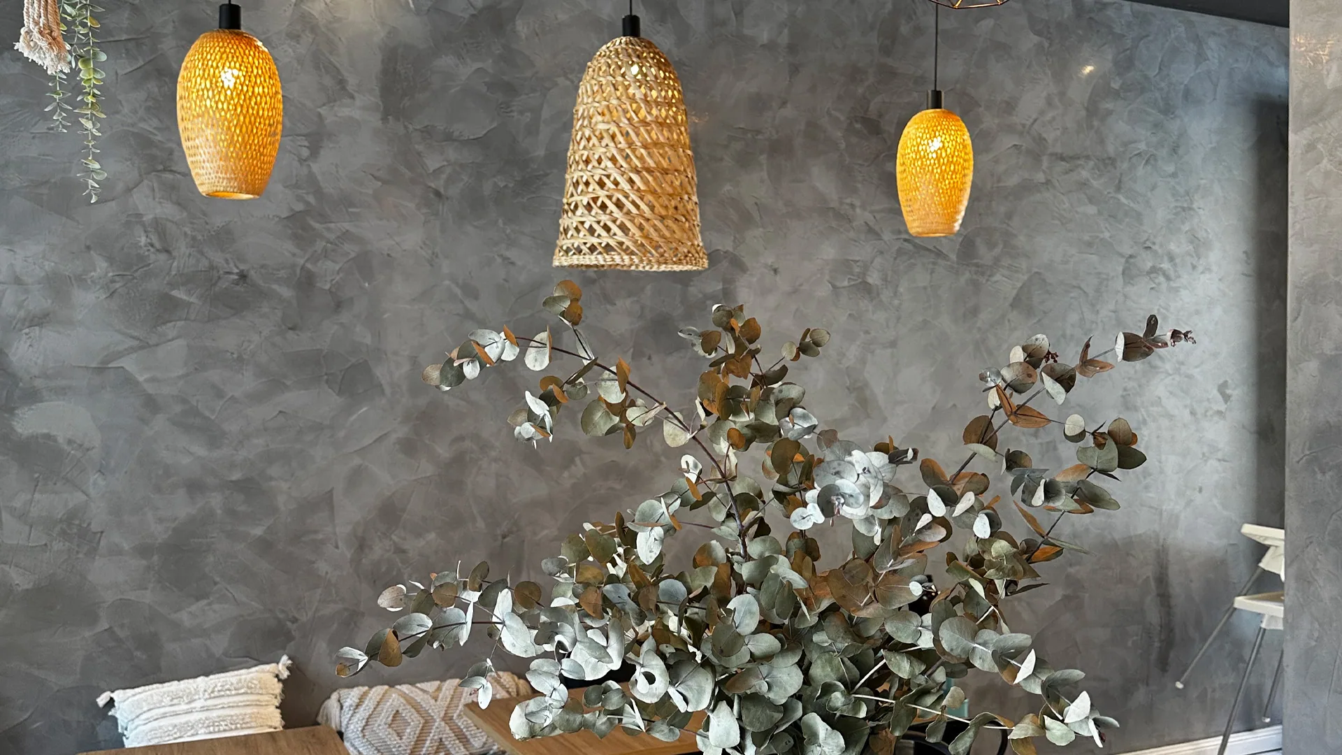 Bohaus Café - venetian plaster wall texture with woven pendant lights