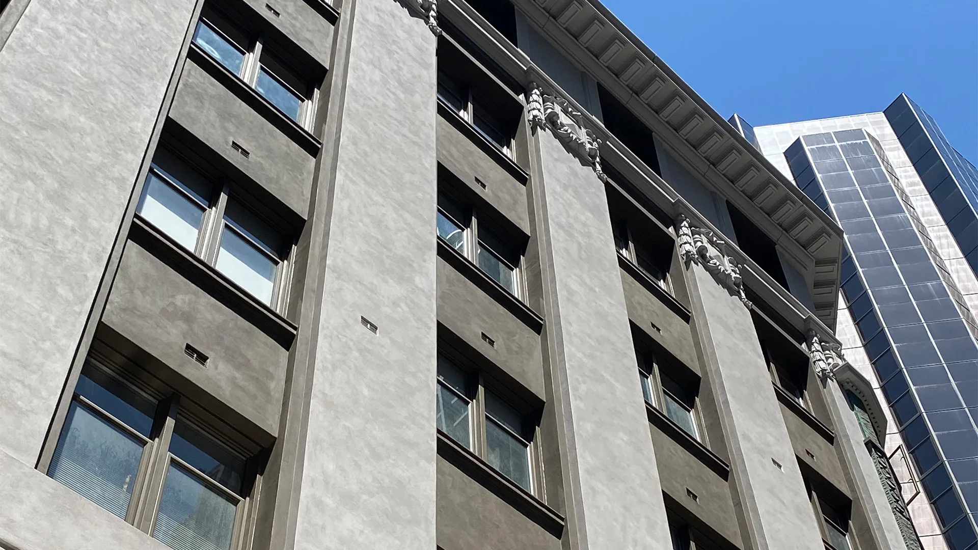 Rolex Building, 192 Pitt Street, Sydney CBD - mineral paint finish across the upper facade pilasters