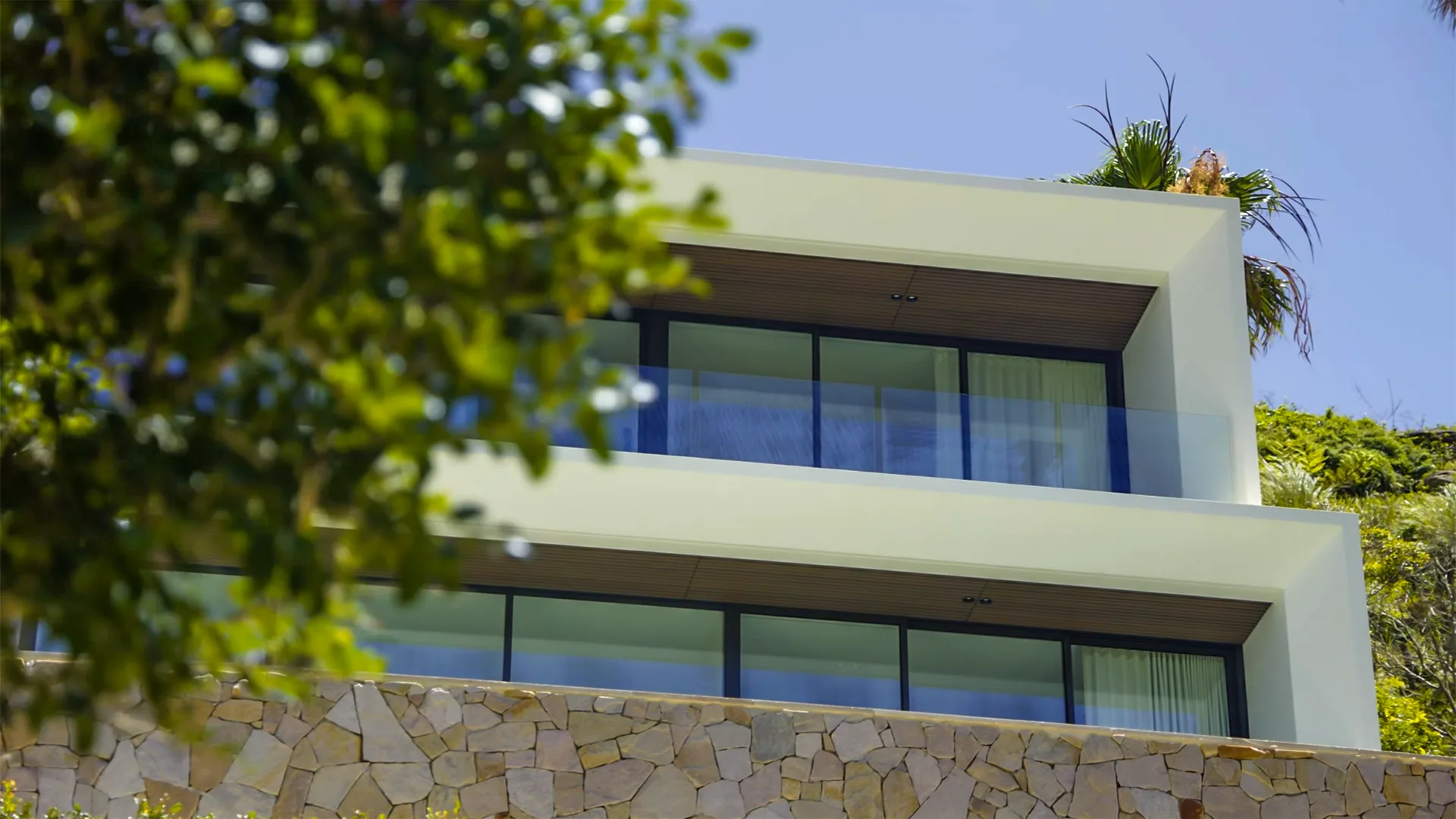 Whale Beach Road, Whale Beach - rendered balconies above the stone base