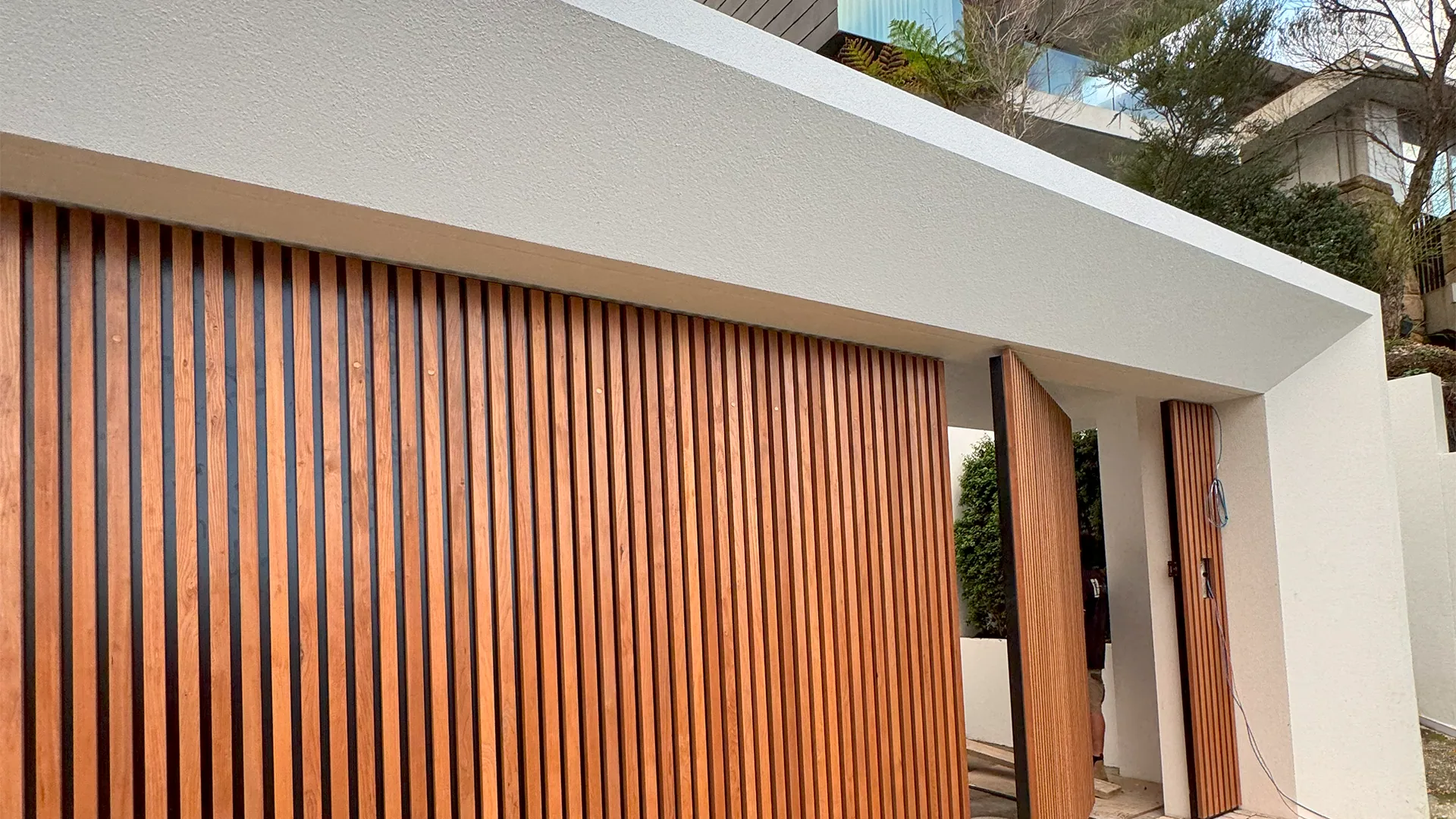 Whale Beach Road, Whale Beach - rendered entry with timber-slat screen